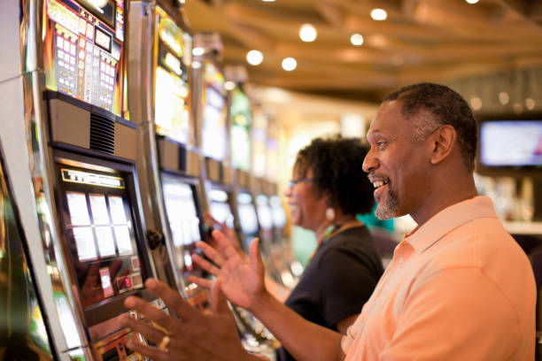 Mobile phone showing AduQ table with multiple players and betting interface on dragon2222